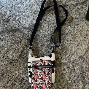 Stylish Black and White Crossbody Bag
Chick-fil-a pattern.